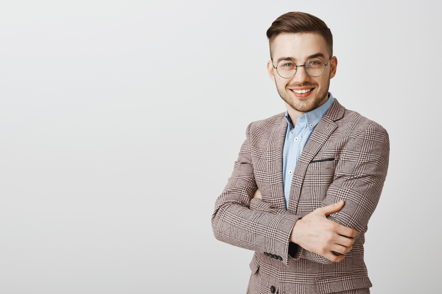 handsome-businessman-suit-glasses-cross-arms-chest-look